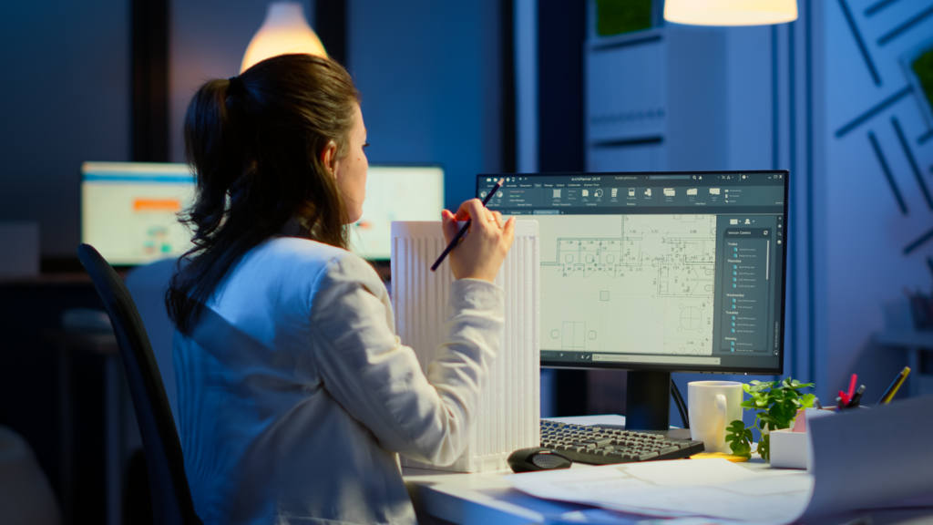 Industrial woman employee studying blueprint idea
