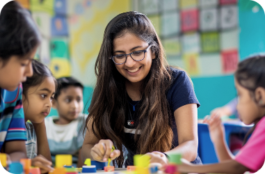 girl-playing-with-group-children-classroom
